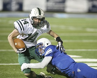 ROBERT K. YOSAY | THE VINDICATOR --..Big run stopped #14 Malvern Travis Tucci is stopped by #3 WR Tim Cooper - ..Regional quarter final at Western Reserve Stadium - Western Reserve Blue Devils VS Malvern Hornets at Louisville.--30-..(AP Photo/The Vindicator, Robert K. Yosay)