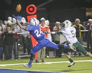 ROBERT K. YOSAY | THE VINDICATOR --..Just out of reach #24 Thomas Benyo reaches for a TD pass as he beats #5 AAron Enold during second quarter action - the ball was over thrown..Regional quarter final at Western Reserve Stadium - Western Reserve Blue Devils VS Malvern Hornets at Louisville.--30-..(AP Photo/The Vindicator, Robert K. Yosay)