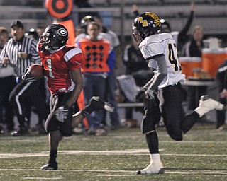 Girard running back #1 Ahmad Eggleston runs away from Black River defender #42 Donatius DeMarco on his way to the endzone for the touchdown.