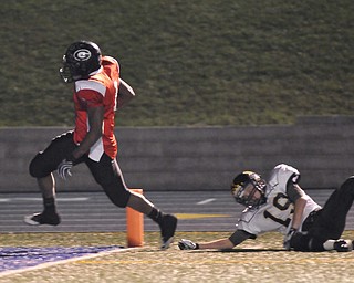 Girard running back #1 Ahmad Eggleston crosses the goal line for the touchdown after avoiding would be Black River tackler #19 Zach Sword.