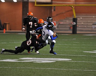 #2 WR Darien Townsend scrambles to break away from Shadyside DB #20 Cody Hudson as Shadyside LB #43 DJ Shoemaker and LB #7 Levi Spencer move in for assistance.