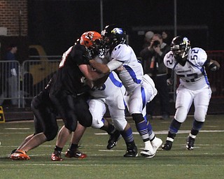 #58 OL Brandon Krock of Shadyside and #17 DE Kaevon Green battle at the line of scrimmage with #52 LB Nick Rios of YCA in the background..