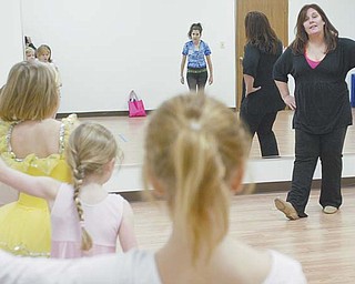 Teri Nobbs, owner of Stage Door Fine and Performing Arts School in Poland, leads a tap-dance class. The recently opened school teaches all types of the performing arts but does not participate in competitive events.