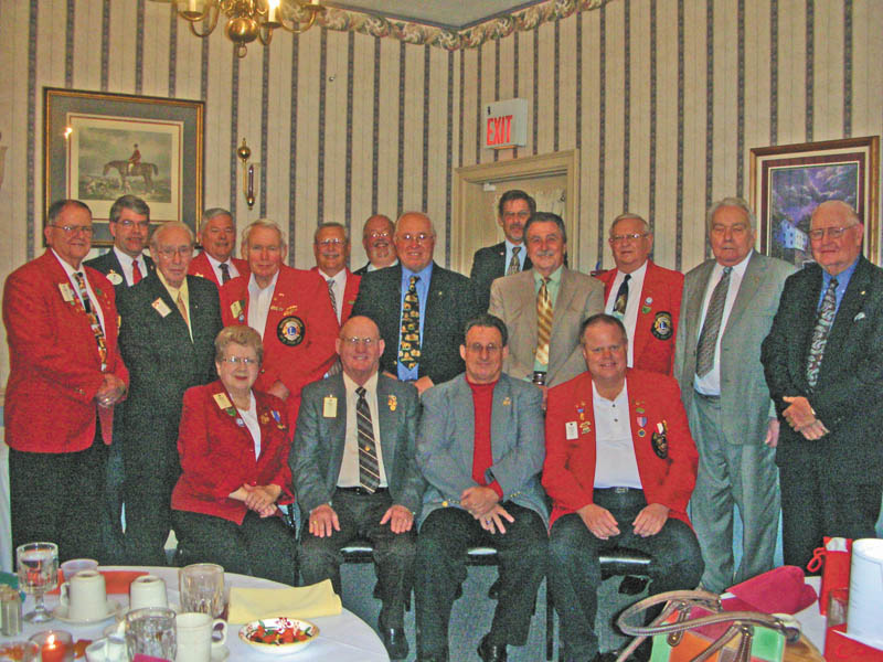 Past District Governors and spouses of District 13-D Lions Clubs had their annual banquet recently at A La Cart in Canfield. Serving as host and master of ceremonies was Past District Governor Harold Ullman of the Crestwood Lions Club. His wife, Joyce Ullman, was hostess. District 13-D comprises clubs in Mahoning, Trumbull, Portage, Stark and Columbiana counties. In front from left are Verna Williams, Warren; Harold Ullman, Crestwood; Ronald Anderson, Lisbon; and Ronald Clifton, Youngstown South Side. Second row: Donald Heldman, East Liverpool; Donald Martin, Crestwood; Ted Filmer, Canfield; Bob Whited, Austintown; Paul Metrovich, Calcutta; Jerald McCullough, Niles; Bud Jenkins, Boardman; and Bill Mundy, Lisbon. Third row: Gov. David Gauch, Crestwood; Robert Booher, Canal Fulton; Tom Kirkbride, Lisbon; Jeff Snyder, Magnolia; and Charles Allcorn, Sebring.