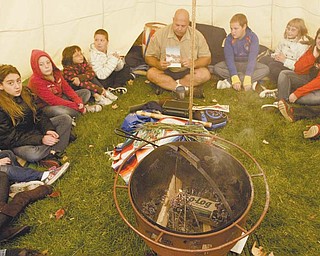 Wes Jones, owner of Native Life Tipi Rental, set up camp on the lawn of Struthers Elementary School. He began teaching classes in Native American culture Monday and will continue to do so through Thursday.