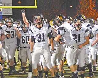 Crestview linebacker Tom Oliver (31) and his teammates celebrate their 41-20 win over St. Thomas Aquinas in the Division V Region 17 semifinal at Ravenna High School. Overcoming the loss of eight offensive starters and revamping the defense has landed the Rebels in a regional final for the first time in school history. They face Kirtland (12-0) on Friday at Mollenkopf Stadium in Warren.