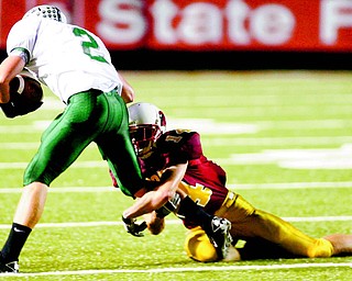Mooney’s Ryan Farragher stops Lake Catholic’s Aaron Phillips during the Division III regional quarterfinal. The Cardinals anticipate an offensive shootout tonight against Dover. The Tornadoes average 45.5 points per game.