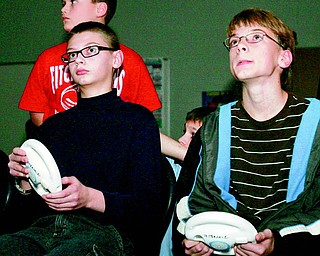 Eric Henderson, 13, and Ethan Saxey, 12, both seventh-graders, begin their competition round of Mario Kart Racing during Thursday night’s fundraiser. The Honor Language Arts students organized and hosted the event to raise money for a variety of charities. Winners in the Wii competition were Jensen Hykes, Just Dance 2; Paul Gavin, boxing; Riley Terrill, Mario Kart and Evan Schobel, Wipeout.