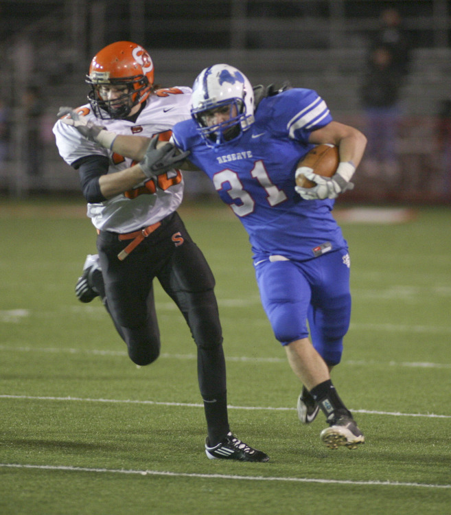 ROBERT  K.  YOSAY  | THE VINDICATOR --..Regional Finals WR #31 Tommy Marlowe takes off on a 30+ yard run during first quarter action as he pushes off Shadyside #20 Cody Hudson -.--30-..(AP Photo/The Vindicator, Robert K. Yosay)