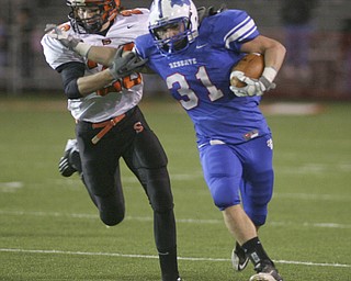 ROBERT K. YOSAY | THE VINDICATOR --..Regional Finals WR #31 Tommy Marlowe takes off on a 30+ yard run during first quarter action as he pushes off Shadyside #20 Cody Hudson -.--30-..(AP Photo/The Vindicator, Robert K. Yosay)