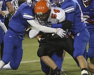 ROBERT K. YOSAY | THE VINDICATOR --..Regional Finals - WR #6 Jeff Clegg and #22 Jon Timko catches Shadyside #54 Matt Hammond behind the line during second quarter action - .--30-..(AP Photo/The Vindicator, Robert K. Yosay)