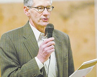 Atty. Alan Wenger of Harrington, Hoppe & Mitchell, representing a group of landowners who have formed an informational group/bargaining unit to negotiate with gas and drilling companies, explains lease details during a meeting at Armstrong Saddlery Arena in Salem.