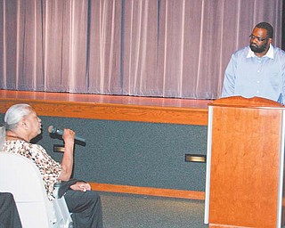 At Sunday’s “The War on Youth Violence” presentation at East High School, Patricia Eiland of Austintown tells Pastor Cecil Monroe how she believes violence can be prevented.