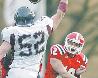 YSU quarterback Kurt Hess fires the ball past Missouri State’s Andrew Biesel in Saturday’s loss. With nearly every major contributor returning next season, the Penguins will not let a bad finish negatively affect recruiting or player development.