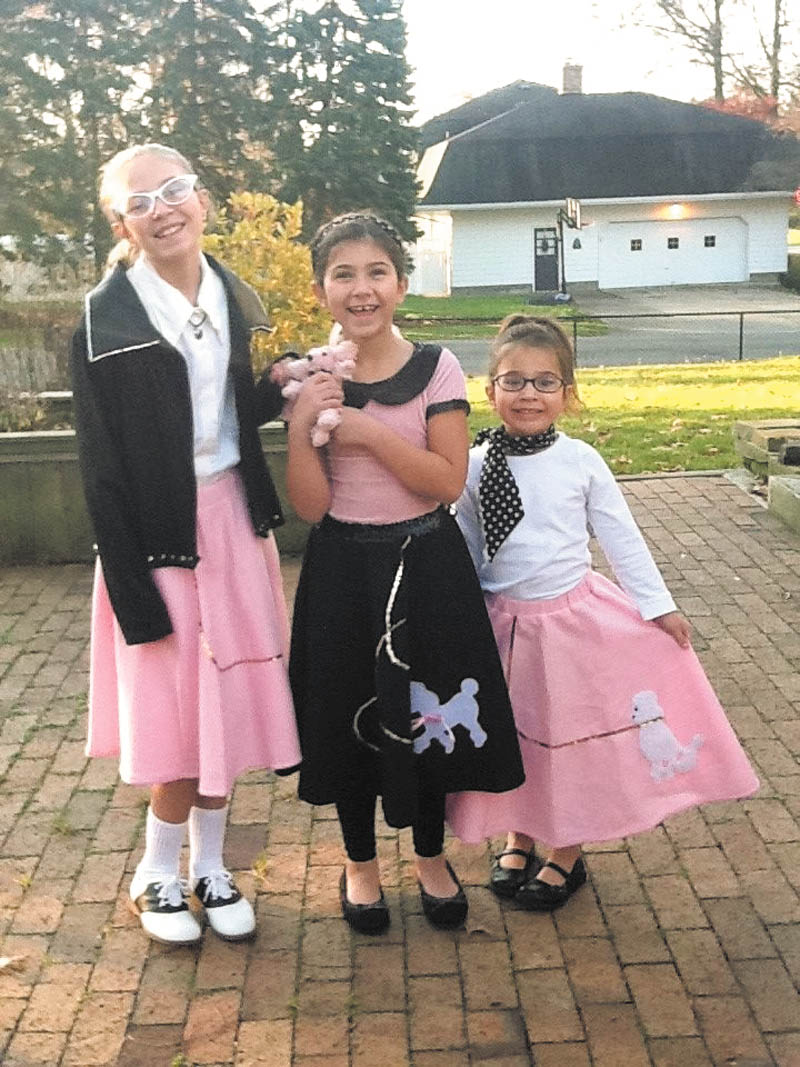 Ready for the record hop: Sisters D'Ella, Mille and Sophie Heschmeyer of Liberty celebrated the 50th day of school when Akiva Academy in Youngstown had a '50s day. The girls donned their best 1950s outfits for the occasion as students and teachers dressed in poodle skirts, rolled up jeans, slicked-back hair and leather jackets. They even listened to music on what the kids described as "weird dishes" — vinyl LPs. The whole elementary school learned about the culture of the 1950s era and enjoyed pizza and root beer floats for lunch.