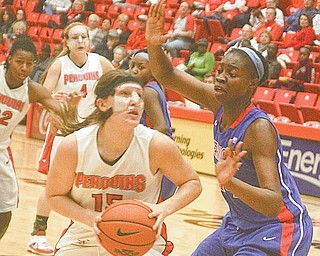 Youngstown State’s Heidi Schlegel (15) goes for two points against American’s Stephanie Anya during the Penguins’ loss on Monday at Beeghly Center.