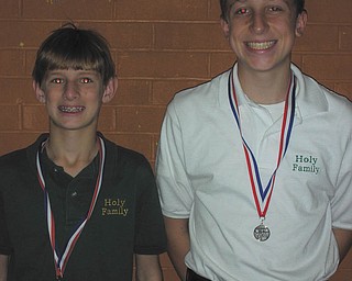 Running in the right direction: Mario Abbattista Jr., left, and Nick Braydich, two eighth-graders from Holy Family School, placed in Habitat for Humanity’s 5K Home Run Race in Poland. Braydich was 29th overall and placed second in his age group. Abbattista was 30th and placed third in his age group. Approximately 150 runners participated in the race.
