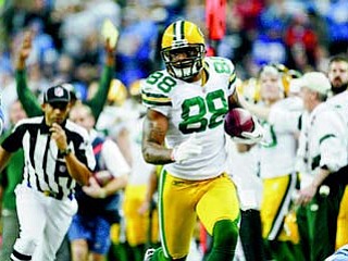 Green Bay Packers tight end Jermichael Finley (88) runs after a catch against the Detroit Lions in the second quarter of an NFL football game in Detroit on Thursday. The Packers won 27-15.