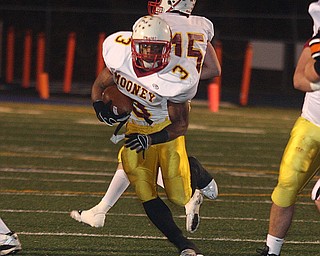 FOOTBALL - (3) Rosevelt Griffin hits the hole Friday night in Uniontown. - Special to The Vindicator/Nick Mays