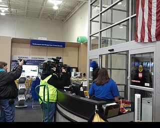 Shoppers enter Best Buy peacefully at midnight