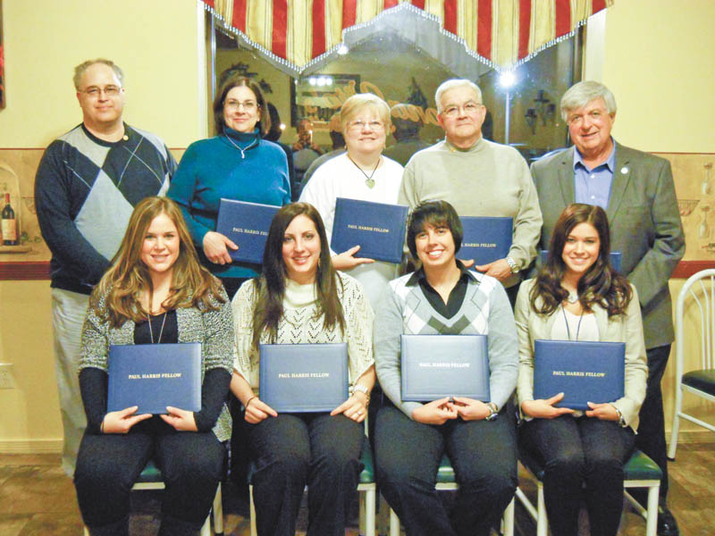 Struthers Rotary Club celebrated its 56th anniversary recently at Dona Vito’s Italian Grille, and eight people received the Paul Harris Fellow. The designation, named after Rotary’s founder, is funded by a donation to the Rotary Foundation and is awarded to members whose lives exemplify the humanitarian and educational objectives of the club. From left, in the back row, Struthers Rotarian Tom Baringer presented the awards to Lisa Baringer, Patricia Krake, Mickey Morell and Al Sauline, and, front row, Stephanie Lanterman, Catherine Cercone, Kristina Daley and Alyssa Baringer 