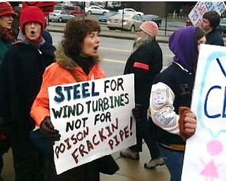 About 100 fracking protestors are standing outside the First National Tower downtown calling for a moratorium on fracking. The protestors also marched around the Covelli Centre, the site of today's Youngstown Ohio Utica and Natural Gas conference and expo.