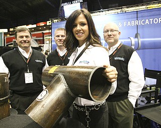 ROBERT K. YOSAY | THE VINDICATOR.. Shanon Snow, office manager for behind her is Randy Debeul - Michael Montgomery and Ray Montgomery "The YOUNG 2011 Conference and Expo Ñ the first Utica shale play conference in the state of Ohio Ñ is a dedicated B2B conference in which national and local companies can exhibit their products and interact with key players in the burgeoning Utica and Marcellus supply chain. at the Covelli Centre .. .-30