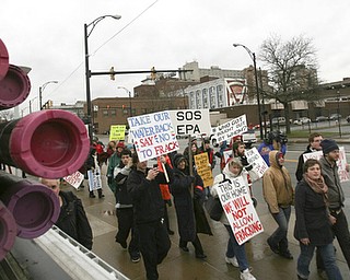 ROBERT K. YOSAY | THE VINDICATOR..While thousands learned about the Utica Shale industry inside the Covelli Centre, about 100 anti-fracking protesters from around Ohio braved the snow and cold to tell their side of the story.."The YOUNG 2011 Conference and Expo Ñ the first Utica shale play conference in the state of Ohio Ñ is a dedicated B2B conference in which national and local companies can exhibit their products and interact with key players in the burgeoning Utica and Marcellus supply chain. at the Covelli Centre .. .-30