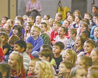 Students from kindergarten through third grade at Lloyd Elementary School in Austintown enjoy a visit from the J.J. Brothers, authors from Akron who travel to schools to promote reading and writing.