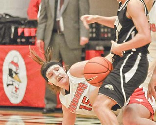 Youngstown State’s Heidi Schlegel (15) dives after a loose ball in front of Western Michigan’s Maria Iaquaniello (23) during a basketball game Wednesday at YSU’s Beeghly Center. Sclegel, a redshirt freshman, had a team-high 15 points for the Penguins, who routed the Mid-American Conference Broncos, 80-55.