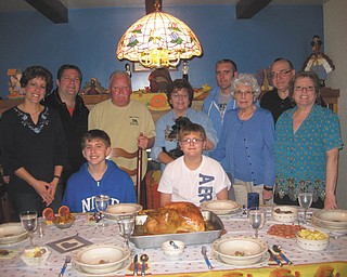 The Cardarelli family gathered for Thanksgiving this year at the home of Carol Cardarelli McGuinness and Jim "Mugsy" McGuinness of Boardman. Carol and Jim love to have family and friends to their house for all the holidays. Pictured are Julie Cardarelli (mom), Carol, Jim, Bernie McGuinness, Phyllis (Cardarelli) and Tony Leone, Tina (Cardarelli) and Chris, Michael and David Merdich, and "Charlie" the dog.
