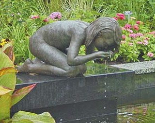 The Kneeling Girl, which was stolen Nov. 23 from Fellows Riverside Gardens, has been found. The Gardens will store the statue until the spring, then restore it to its perch above this pool in the Beeghly Garden.