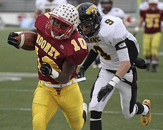 Justin Ellis Moore out runs Shawnee #9 Jordan Huggins as he gets a first down. Youngstown Cardinal Mooney won their 8th championship as they beat the Shawnee Braves in Fawcett Stadium 21-14. (AP Photo/The Vindicator, Robert K. Yosay)