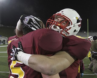 #5 JT Thiel and #8 Ryan Lanzo celebrate the championship. Youngstown Cardinal Mooney won their 8th championship as they beat the Shawnee Braves in Fawcett Stadium 21-14. (AP Photo/The Vindicator, Robert K. Yosay)