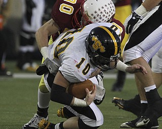 Mooneys #30 Joe Stana sacks #10 Brad Jarzab during first half action. Youngstown Cardinal Mooney won their 8th championship as they beat the Shawnee Braves in Fawcett Stadium 21-14. (AP Photo/The Vindicator, Robert K. Yosay)