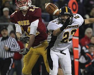 Broken up pass as Mooneys #14 Ryan Farragher has the ball knocked away by Shawnee #23 Drew Young. Youngstown Cardinal Mooney won their 8th championship as they beat the Shawnee Braves in Fawcett Stadium 21-14. (AP Photo/The Vindicator, Robert K. Yosay)
