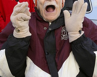 JESSICA M. KANALAS | THE VINDICATOR..William Craft, 92, of Youngstown expresses his joy for the holiday season during the holiday parade in Downtown Youngstown.