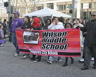 JESSICA M. KANALAS | THE VINDICATOR..Wilson Middle school students wave during the holiday parade in Downtown Youngstown.