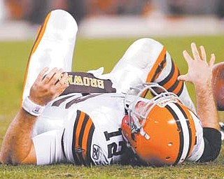 Cleveland Browns quarterback Colt McCoy lies on the field after he was sacked by the Baltimore Ravens in the fourth quarter of an Sunday’s game in Cleveland. The Browns lost the game 24-10 and will have a short turnaround before traveling to Pittsburgh to face the Steelers on Thursday.