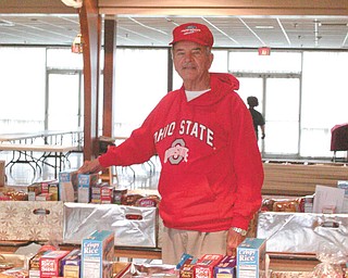 Members of the Western Mahoning County Kiwanis Club took part in the annual Thanksgiving Basket Giveaway. The project, in its 26th year, originated with the Mill Creek Kiwanis Club. Eighty food baskets were distributed in the Youngstown area this year. Serving as chairman for the project was club President Don Augenstein. Western Mahoning County Kiwanis will sponsor pictures with Santa during regular hours Saturday, Dec. 10 and Dec. 17 at the Canfield Farmers National Bank on Broad Street/
