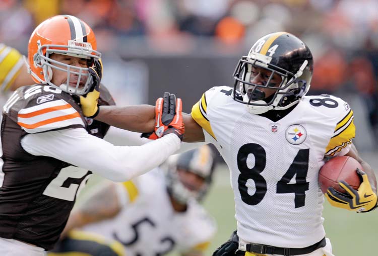 Pittsburgh Steelers wide receiver Antonio Brown (84) is pushed out of bounds by Cleveland Browns safety Sabby Piscitelli during their game on Jan. 2 in Cleveland. Pittsburgh has won 14 of the last 15 meetings between the rivals.
