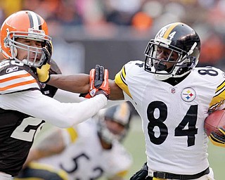 Pittsburgh Steelers wide receiver Antonio Brown (84) is pushed out of bounds by Cleveland Browns safety Sabby Piscitelli during their game on Jan. 2 in Cleveland. Pittsburgh has won 14 of the last 15 meetings between the rivals.