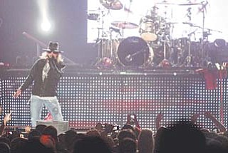 Axl Rose, lead singer of the rock band Guns N’ Roses, performs at the Covelli Centre in downtown Youngstown on Wednesday night. Coincidentally on Wednesday, GNR also was selected for induction into the Rock and Roll Hall of Fame in Cleveland next April. Rose took to the Covelli stage at about 11 p.m. Wednesday.