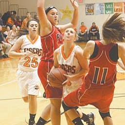 Newton Falls’ Rachel Ellis, center, tries to split Fitch defenders Cassie Custer, left, and Megan Sefcik (11) as Falls’ Victoria Workman (25) trails during Thursday’s game in Newton Falls.