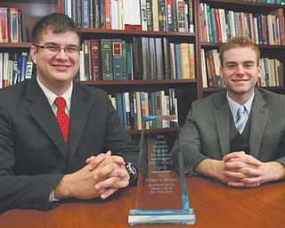 Youngstown State University seniors Travis Watson, left, and Kevin Hulick, both of Austintown, won first place at the Midwest Regional Tournament of the American Collegiate Moot Court Association. They head to the national competition next month.