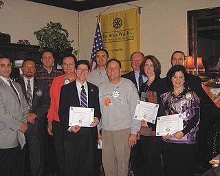 Thirteen members from the Rotary Club of Austintown recently received merit awards for perfect attendance during the first quarter. Shown above, from left to right: Vince Colaluca, Mark Cole, Brian Frederick, Ron Carroll, Dr. Mitch Dalvin, David Buttar, Gary Reel, Chuck Baker, Jennifer Connolly, Brian Laraway and President Deanna Spirko. Absent from the picture are Jerry Haber and Ram Kasuganti.