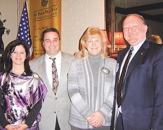 At a recent meeting of the Rotary Club of Austintown, Chuck Baker inducted new member, Tracie A. Kaglic, architect and project manager for the new school project. Her sponsor was Vince Colaluca. From left to right are Austintown Rotary President Deanna Spirko, Colaluca, Kaglic and Baker.