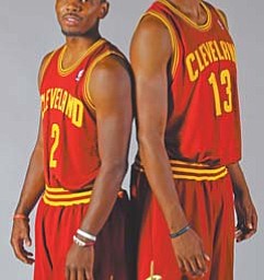 Cleveland Cavaliers rookies Kyrie Irving (2) and Tristan Thompson (13) pose for a photo during the team’s media day Monday.