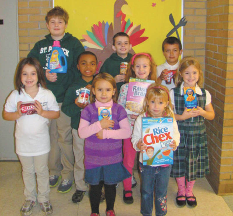 Students collect for the needy: St. Patrick School in Hubbard recently had a food drive. Hoping to make the holidays a little easier for those in need, students in each classroom collected specific items that included canned and boxed food, household cleaning supplies and paper products. They filled more than 15 boxes and bags, which were donated to the St. Vincent de Paul Society for distribution. Among the students who participated are, left to right, front row: Mollie Greco, Nora DePizzo and Lauren Murcko; middle row: Matt Jacobs, Elizabeth Sandy and Elaina Matricardi; and back row: Daniel Robinson, Cooper Muccio and Hayden Lopez.

