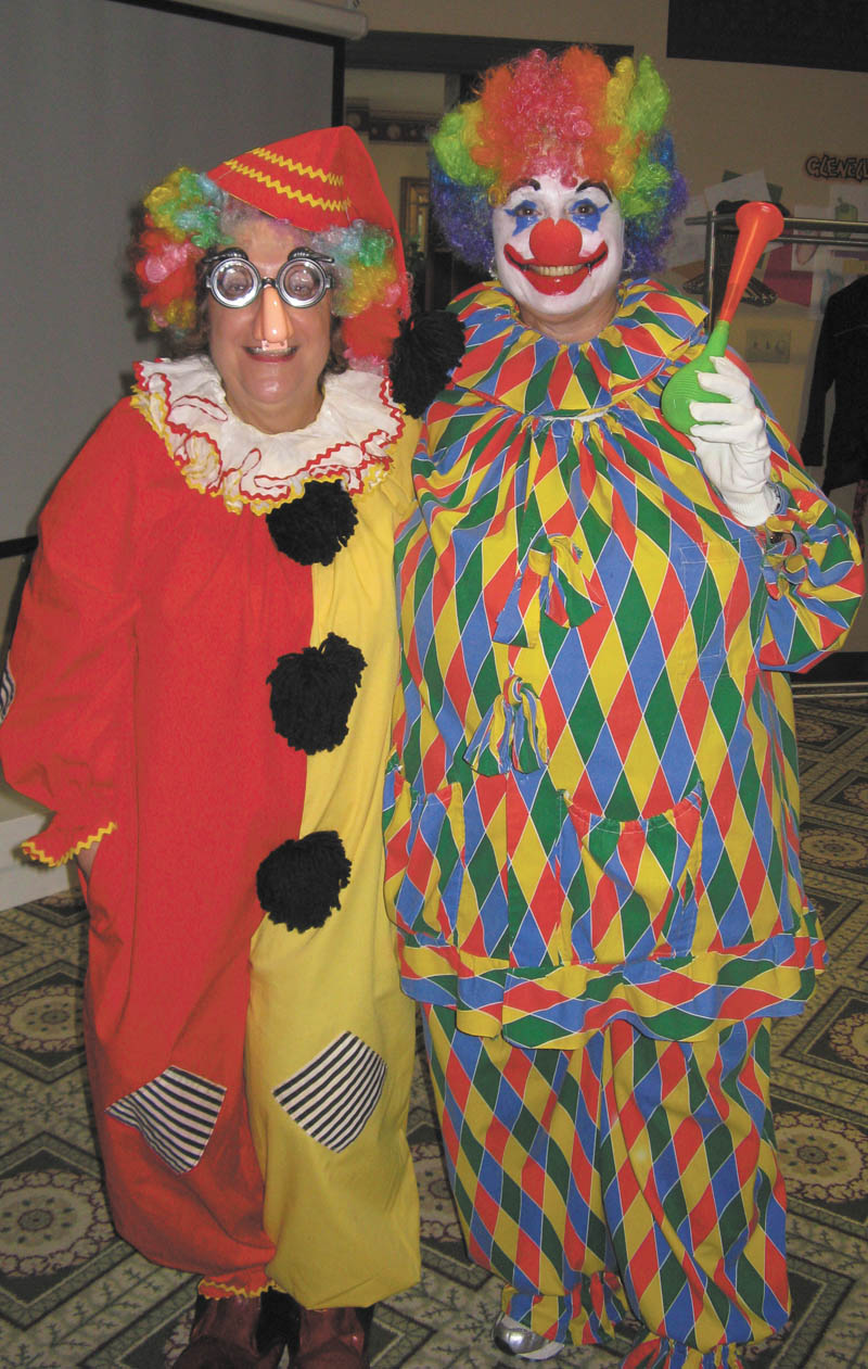 Clowning around: Boardman-Poland Junior Women’s League recently sponsored an Idora Park theme luncheon for the residents of Glenellen Senior Living Community in North Lima. League members Debbie Chopp and Nina Lowry, above, dressed as clowns to greet residents and hand out beaded necklaces. Participants enjoyed corn dogs, french fries and other “park” food. After games and a movie about the Youngstown park, residents reminisced, many recalling the large ballroom and weekends spent dancing to big band sounds.
